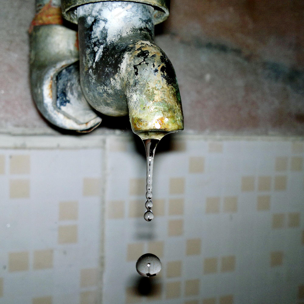 A tap leaking in the kitchen of a rented home.