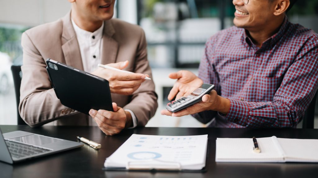 Discussing financial statements and calculations.