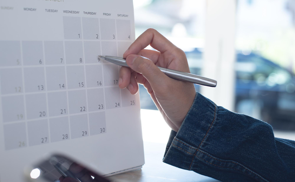 Person reviewing a calendar and a legal letter to check limitation period deadline
